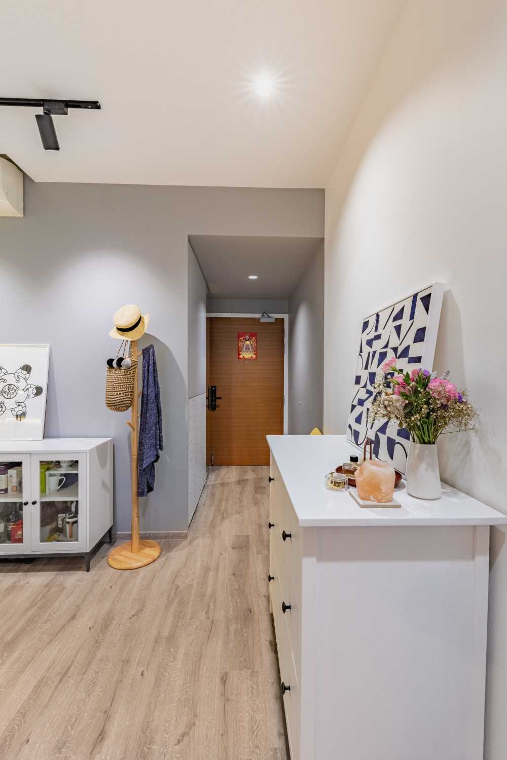 Scandinavian Hallway with Bookshelf and Artwork