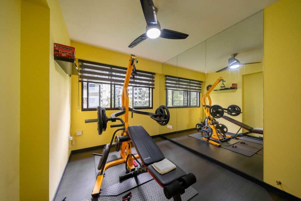 Contemporary Home Gym with Seating Bench and Storage Cabinets