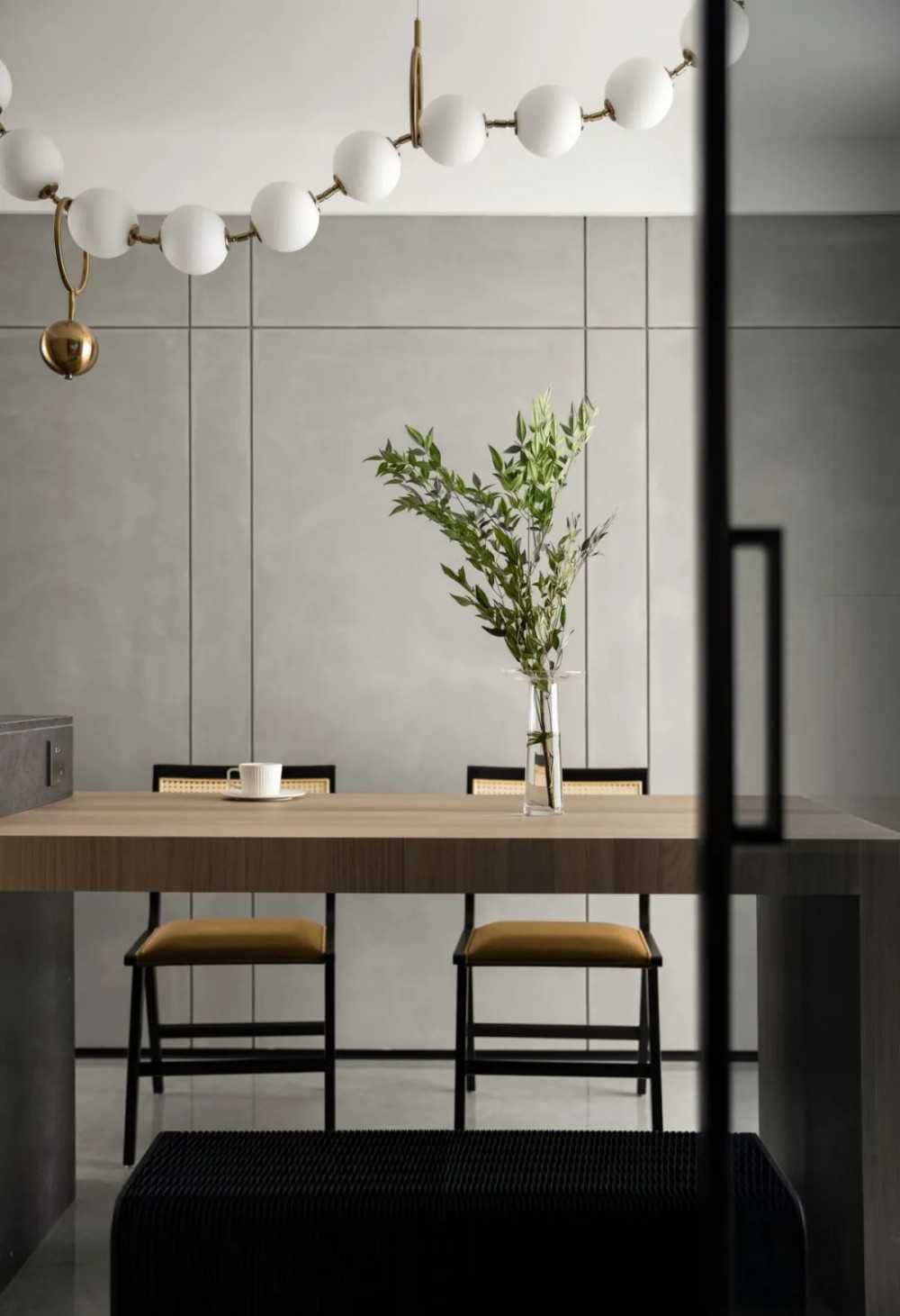 Contemporary Dining Room with Homogeneous Tiles and Feature Wall