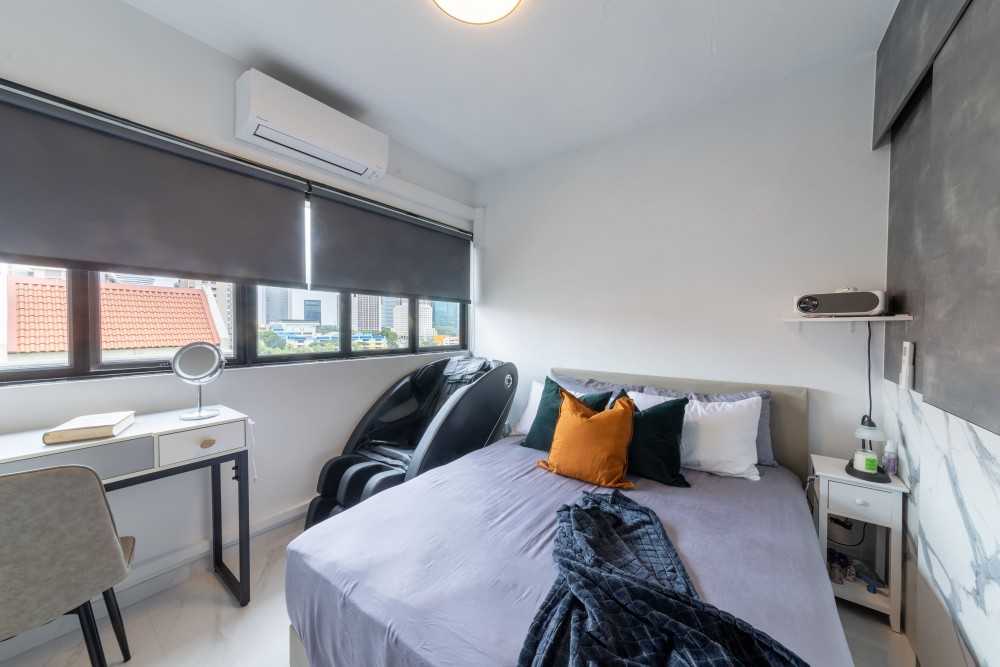 Modern Bedroom with Herringbone Tiling and Ceiling Light