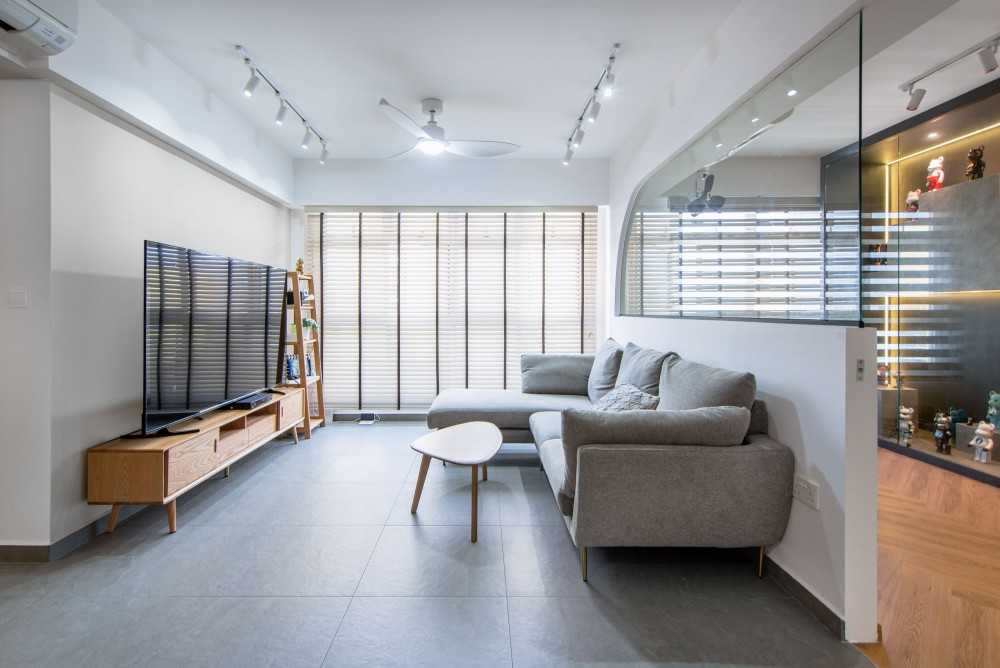 Modern Living Room with Bookshelf and Homogeneous Tiles