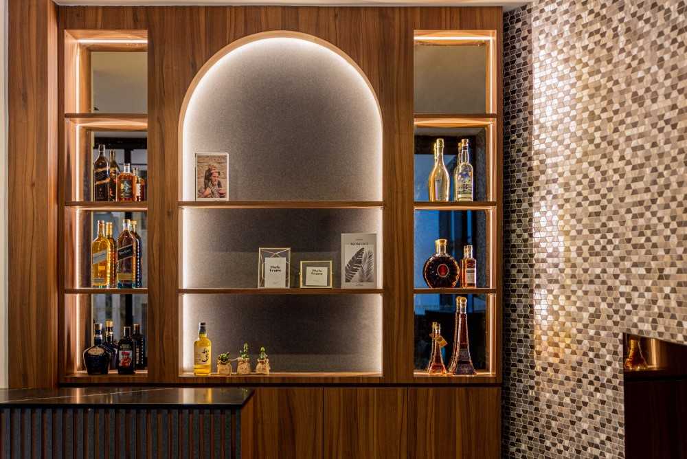 Eclectic Wine Cellar with Drinkware and Shelving Units