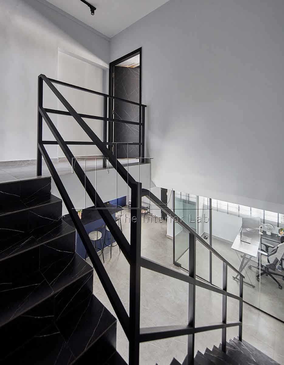 Contemporary Hallway with Marble Floor and Staircase