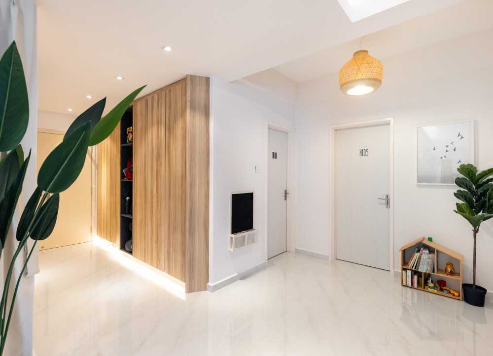 Minimalist Foyer with Cove Lighting and Artwork