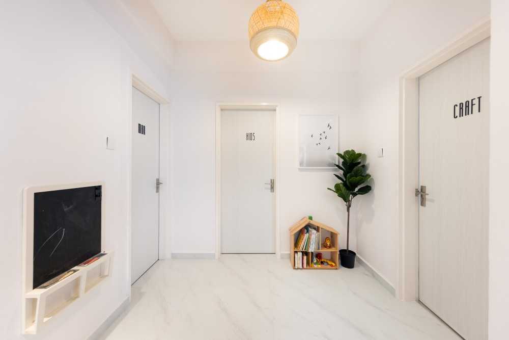 Minimalist Hallway with Bookshelf and Marble Floor