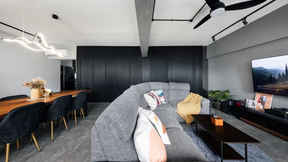 Industrial Living Room with Cement Floor and Feature Wall