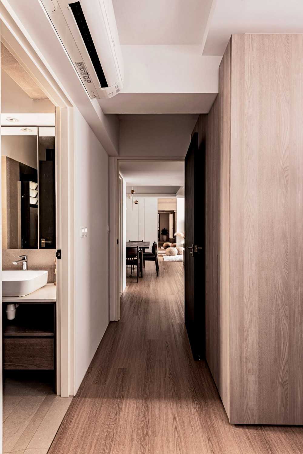 Contemporary Hallway with Bookshelf and Artwork