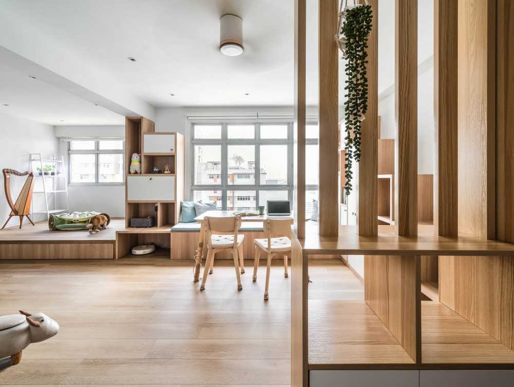 Scandinavian Living Room with Bookshelf and Wood Flooring