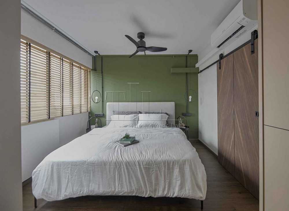 Eclectic Bedroom with Wood Flooring and Bedside Table
