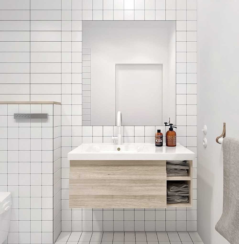 Industrial Bathroom with Homogeneous Tiles and Mirror