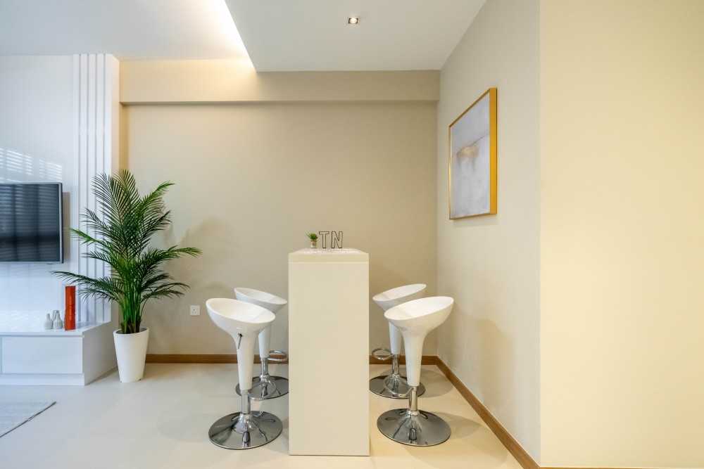 Minimalist Dining Room with Cove Lighting and Drop Ceiling