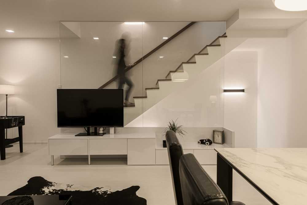 Minimalist Living Room with Herringbone Tiling and Cement Floor