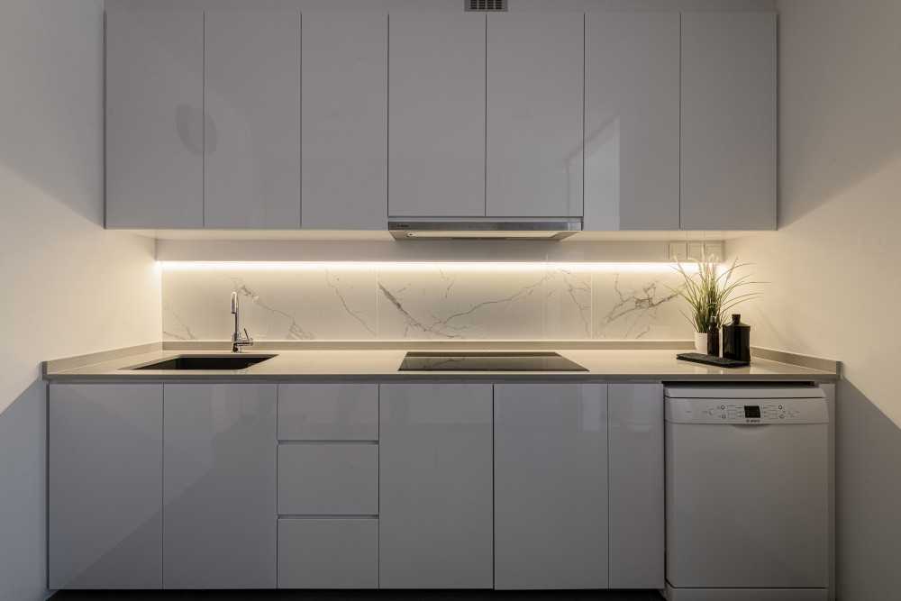 Minimalist Kitchen with Wood Flooring and Kitchen Island