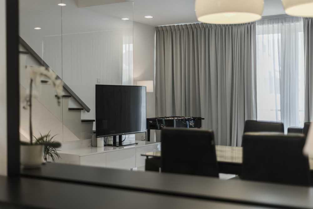 Minimalist Living Room with Wood Flooring and TV Console