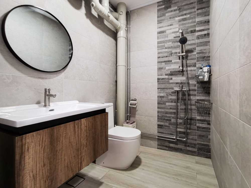 Scandinavian Bathroom with Homogeneous Tiles and Mirror
