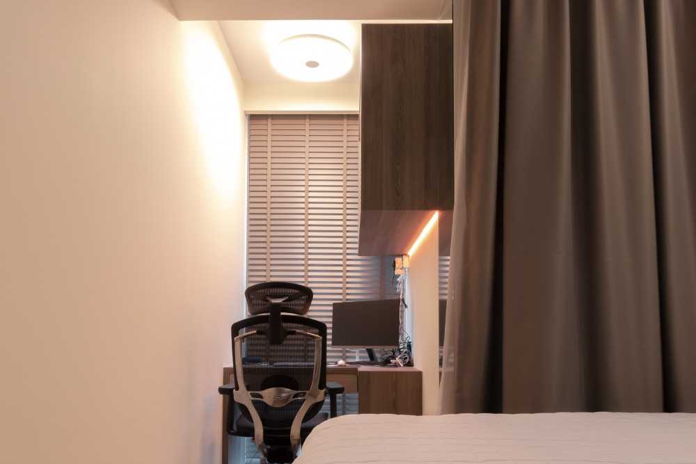 Modern Bedroom with Bookshelf and Ceiling Light