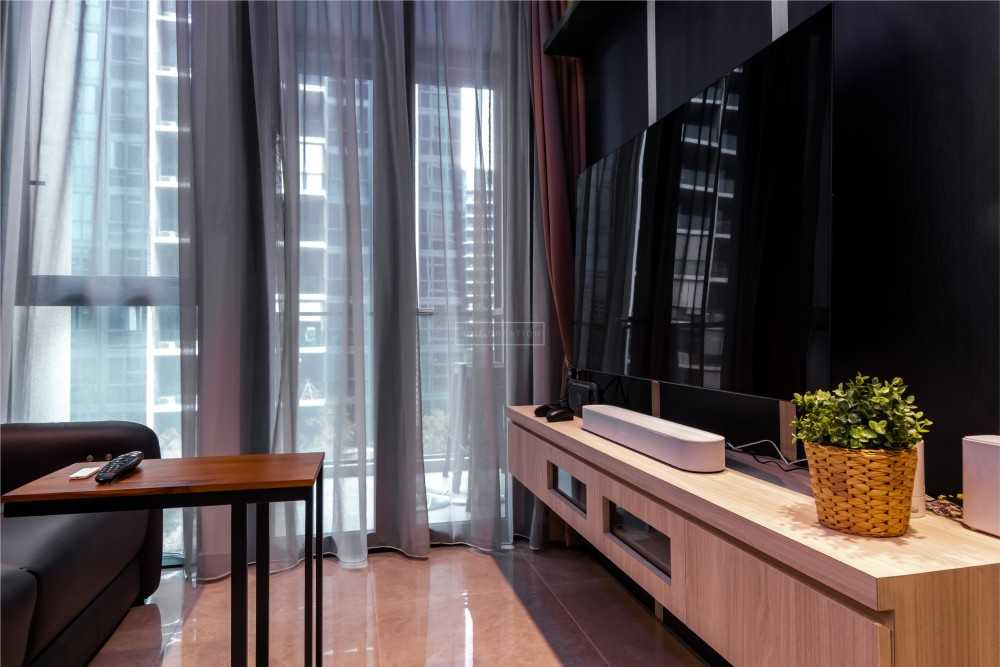 Modern Living Room with TV Console and Ceiling Light