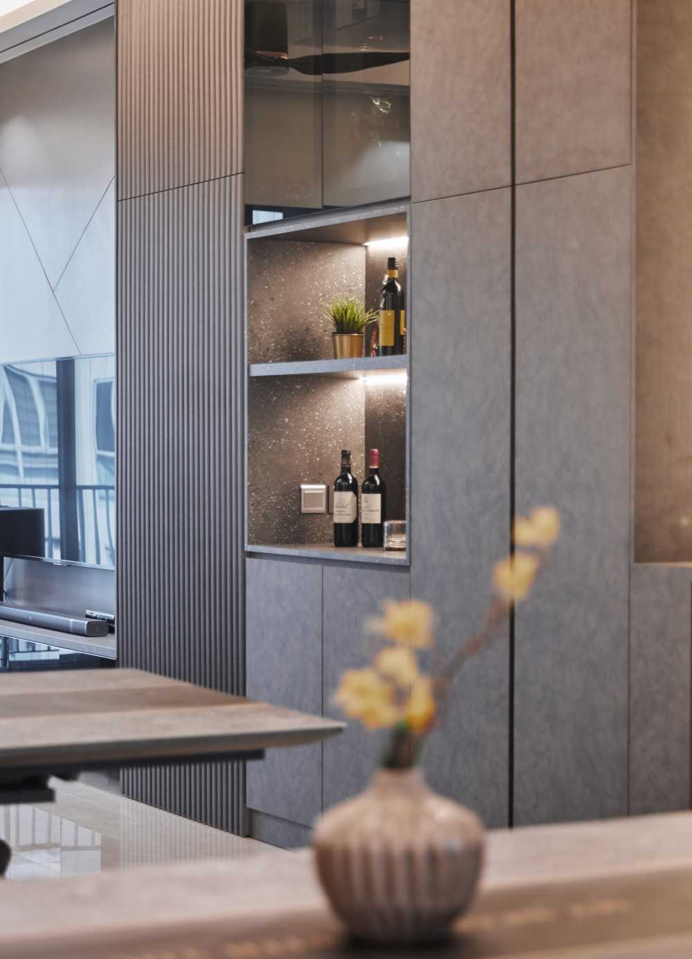 Modern Dining Room with Cove Lighting and Display Cabinets