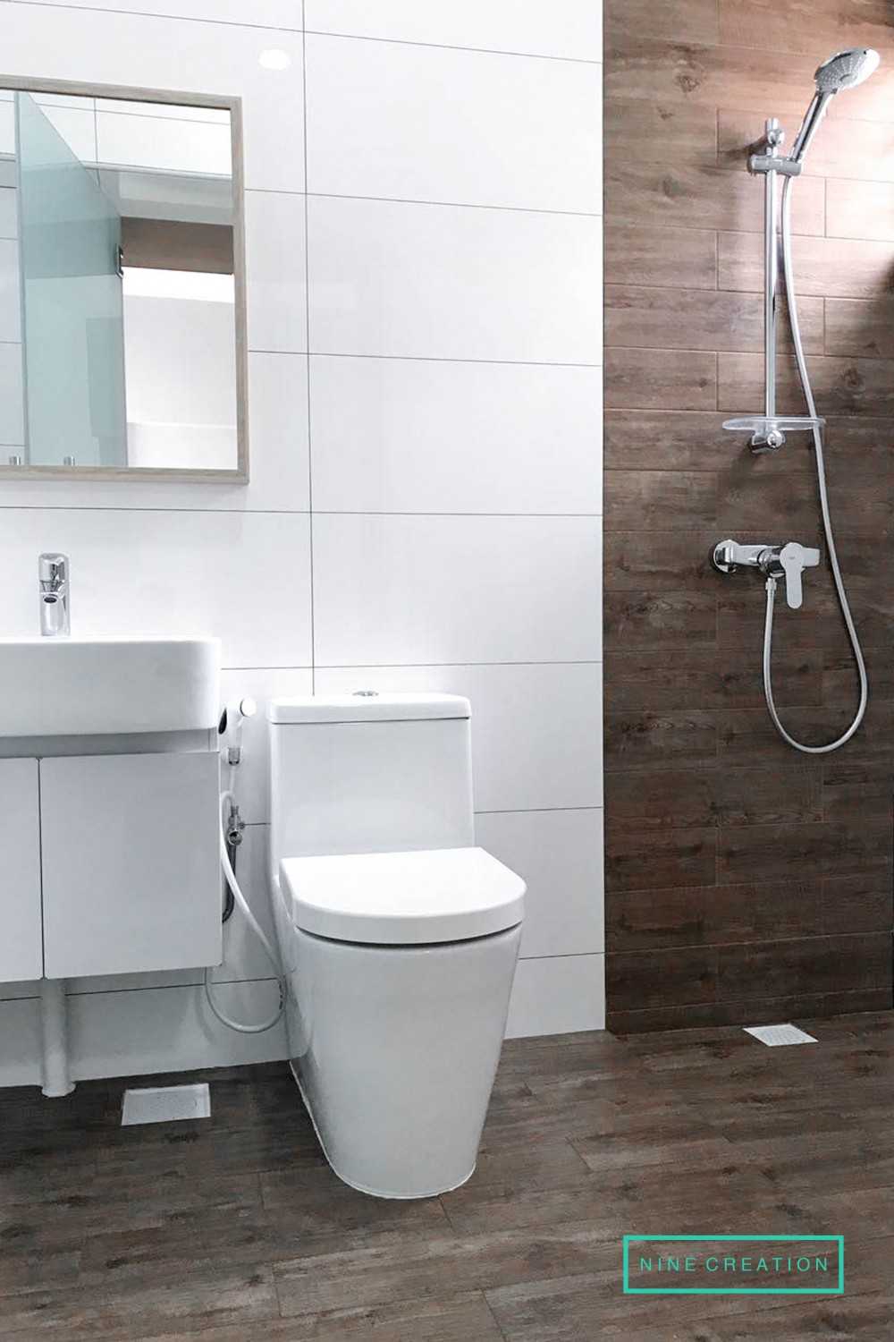 Scandinavian Bathroom with Homogeneous Tiles and Shower Screen