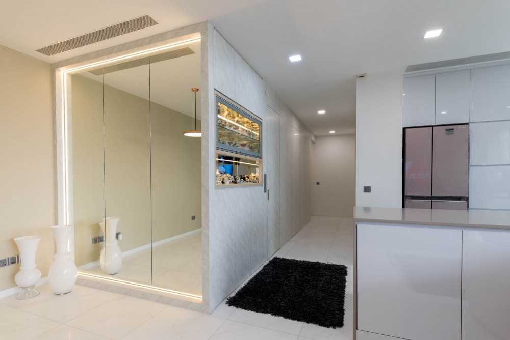 Modern Hallway with Bookshelf and Artwork