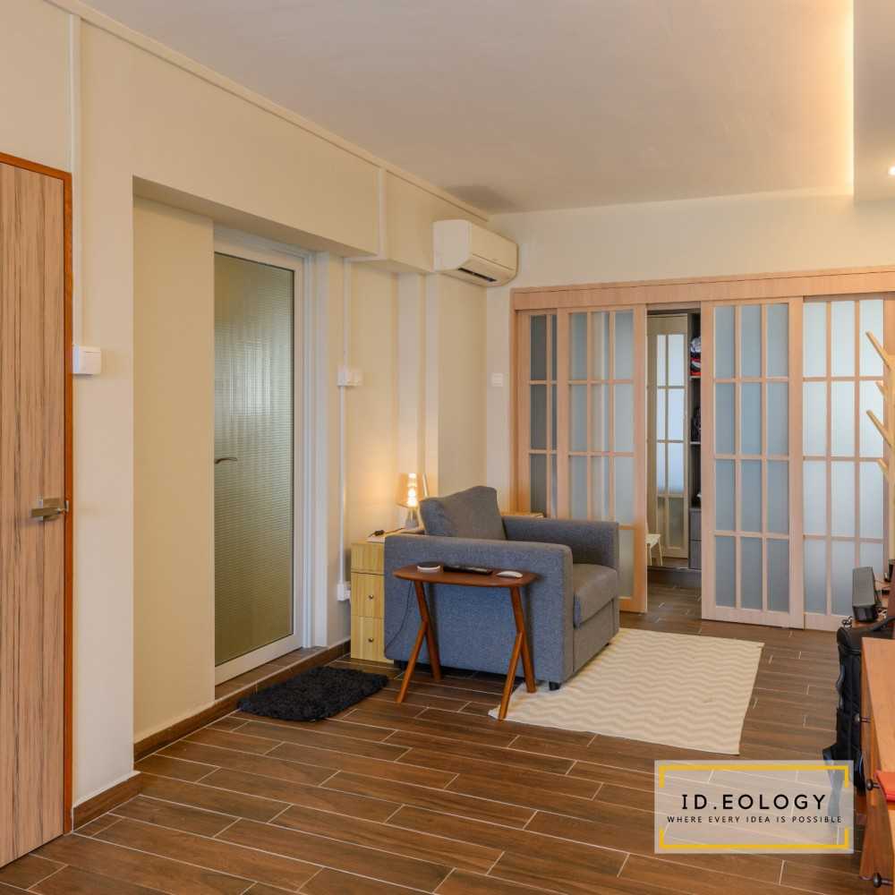 Minimalist Bedroom with Wood Flooring and Drop Light