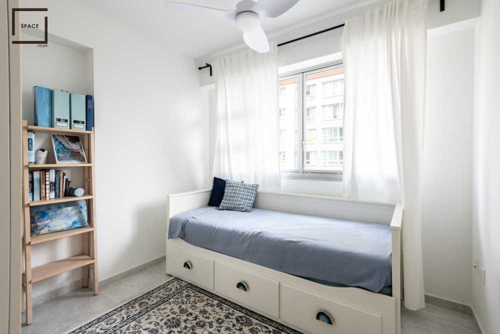 Country Bedroom with Bookshelf and Bed