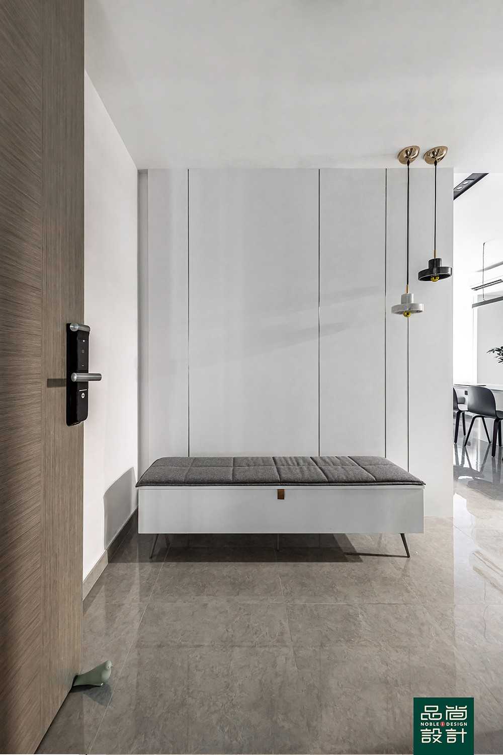 Modern Foyer with Marble Floor and Feature Wall
