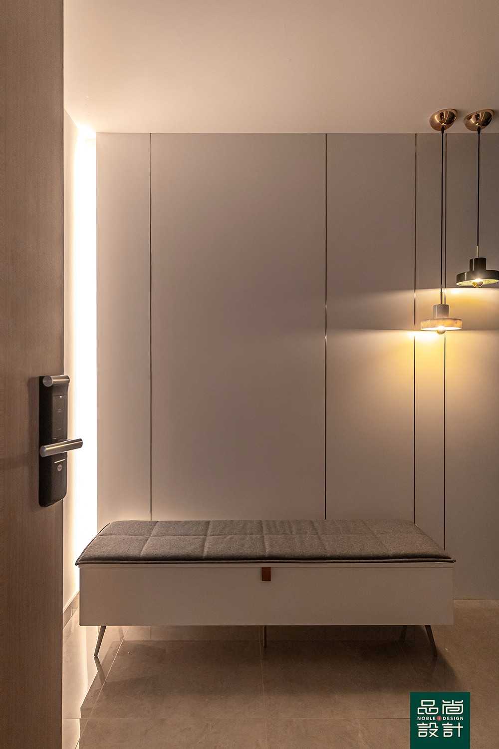 Modern Foyer with Feature Wall and Cove Lighting