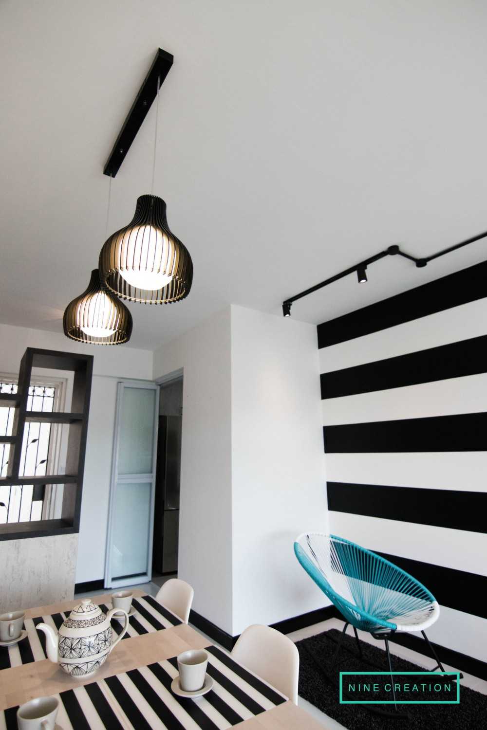Modern Dining Room with Drop Light and Dining Table
