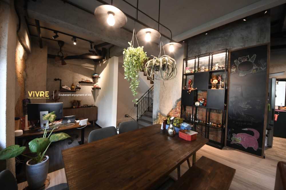 Industrial Dining Room with Cove Lighting and Chandelier