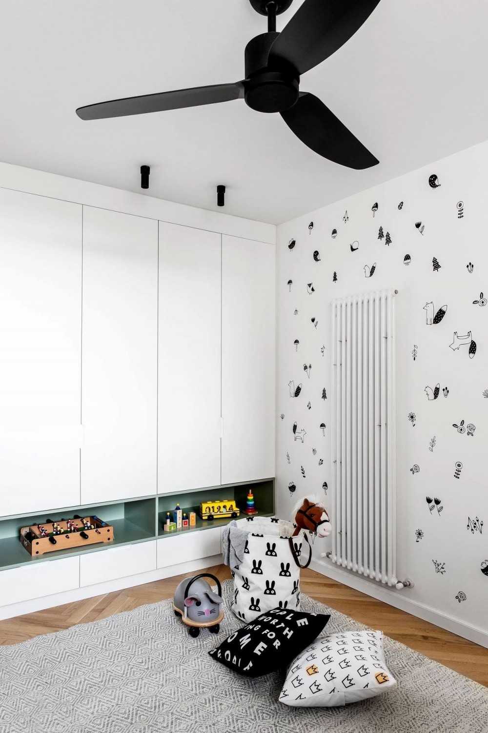 Contemporary Living Room with Bookshelf and Herringbone Tiling