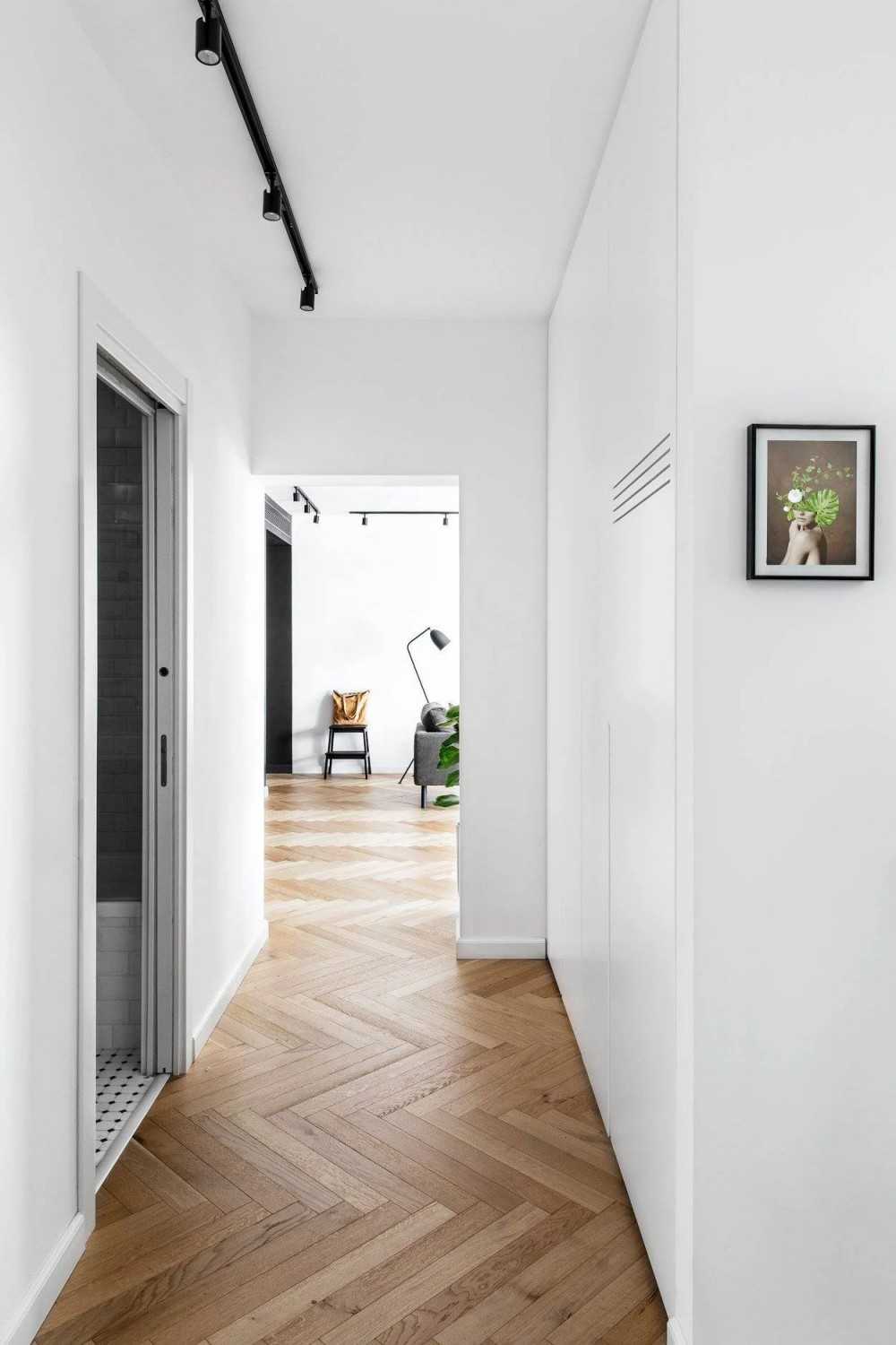 Contemporary Living Room with Herringbone Tiling and Artwork