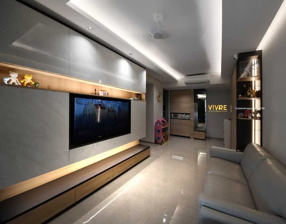Modern Living Room with Bookshelf and Homogeneous Tiles