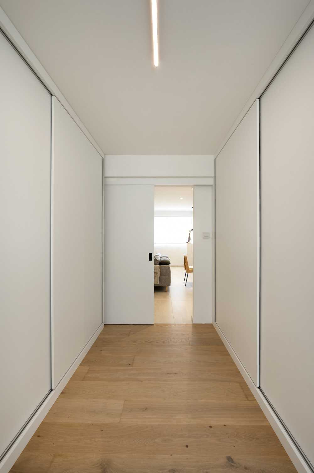 Eclectic Bedroom with Wood Flooring and Wardrobe