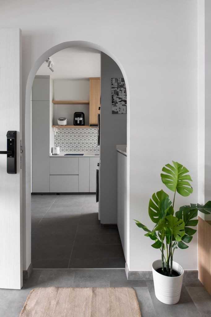 Minimalist Kitchen with Homogeneous Tiles and Herringbone Tiling