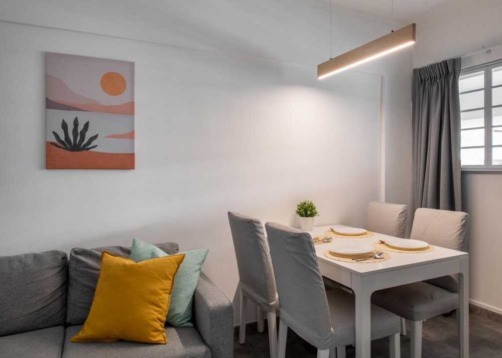 Minimalist Dining Room with Drop Light and Cove Lighting