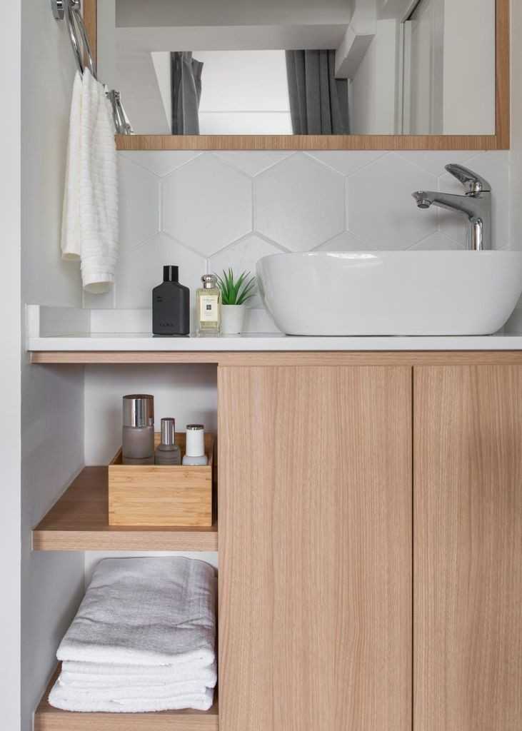 Minimalist Bathroom with Wood Flooring and Mirror