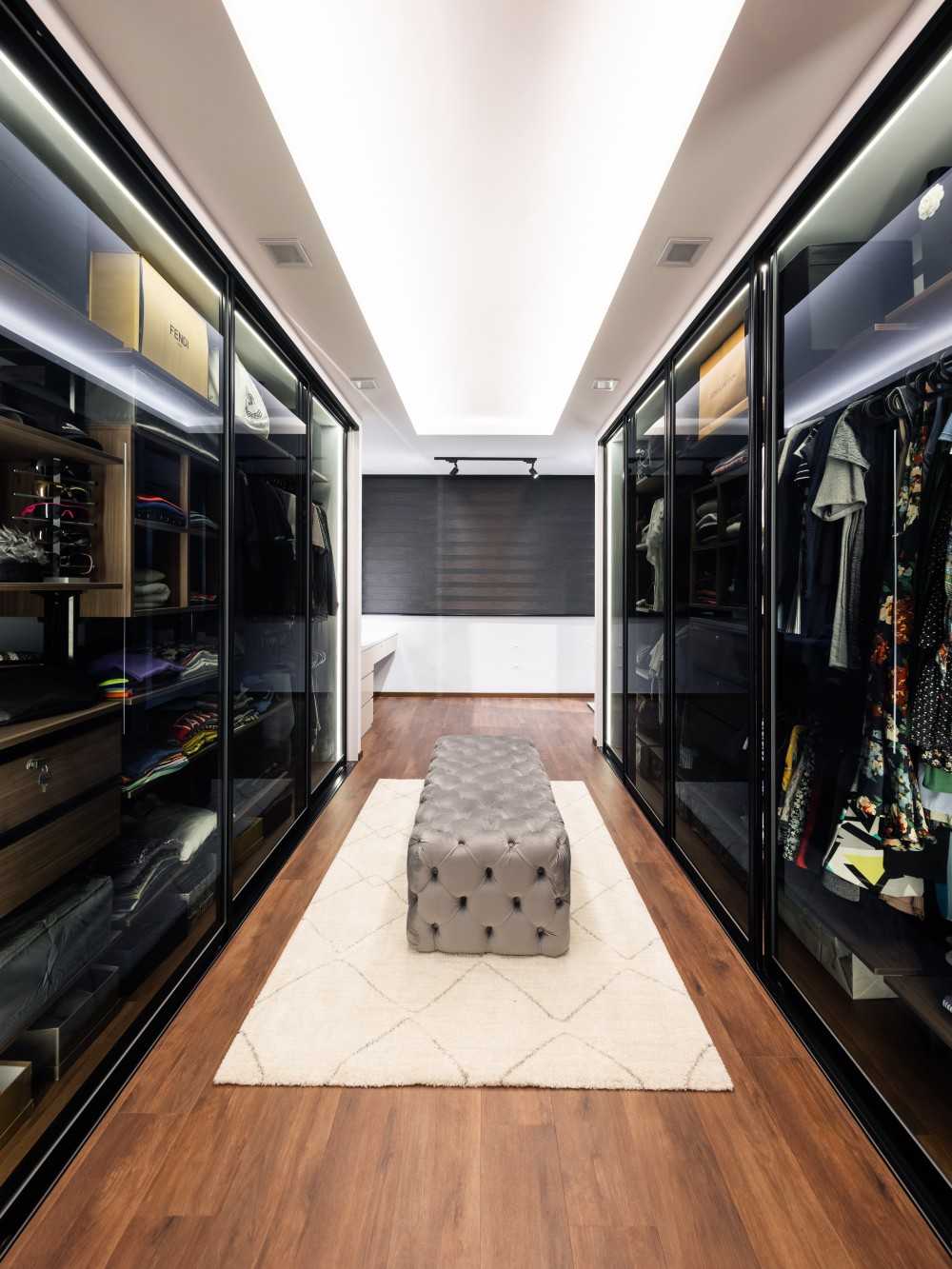 Contemporary Walk-in Wardrobe with Settee and Cove Lighting