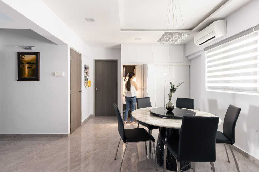 Contemporary Dining Room with Cove Lighting and Chandelier
