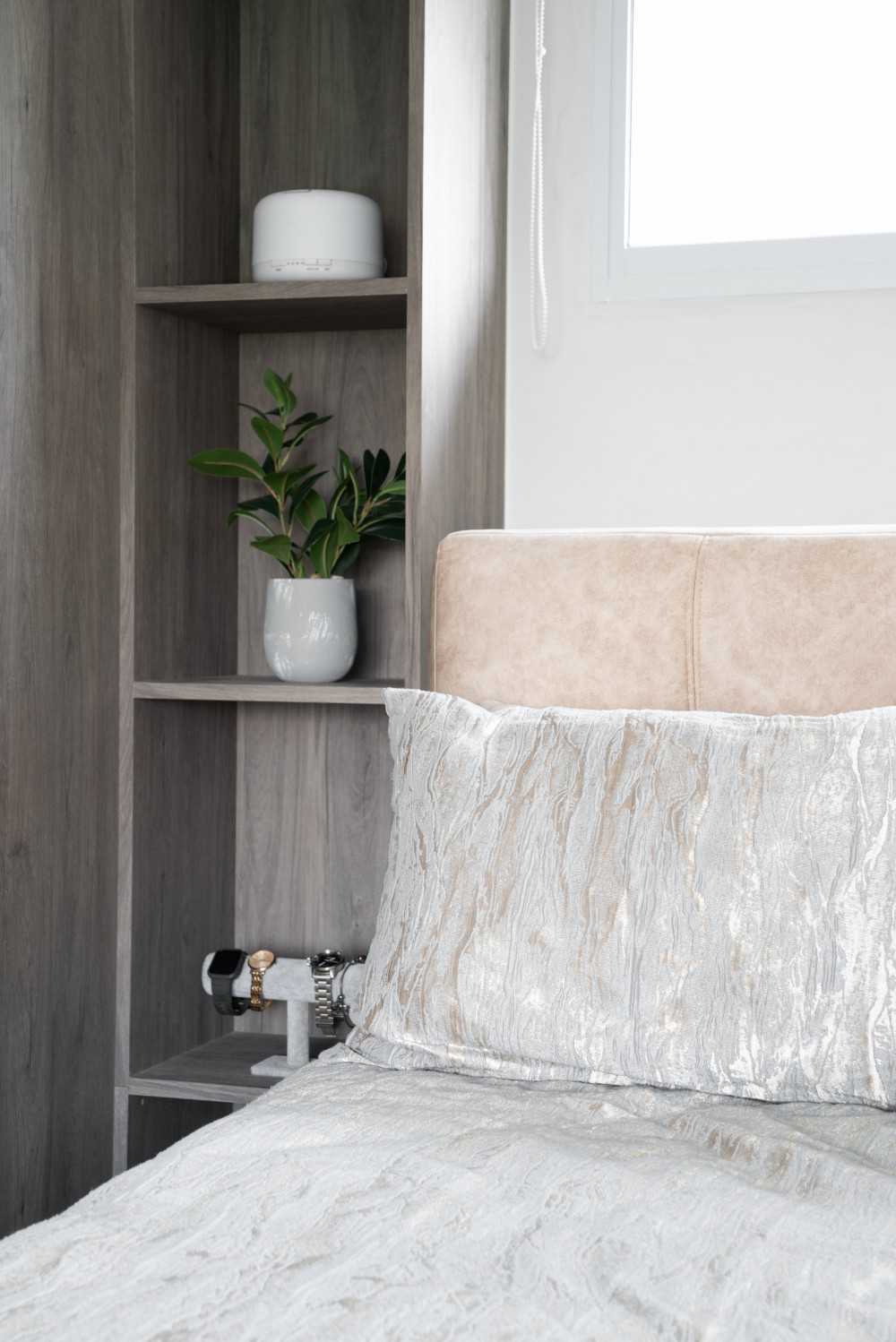 Scandinavian Bedroom with Shelving Units and Bed