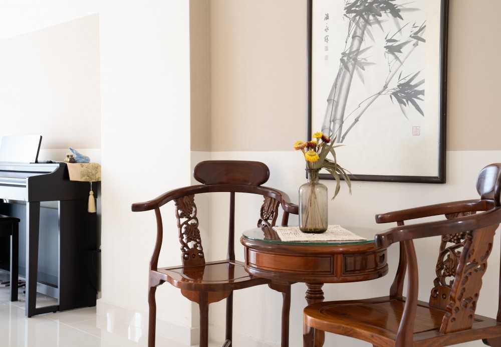 Scandinavian Foyer with Paintings and Armchairs