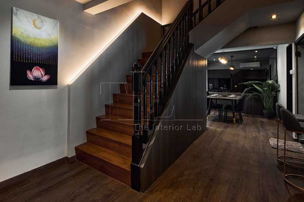 Modern Entryway with Staircase and Paintings