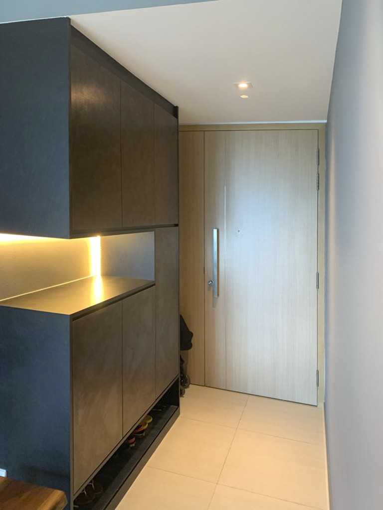 Modern Entryway with Wardrobe and Paintings