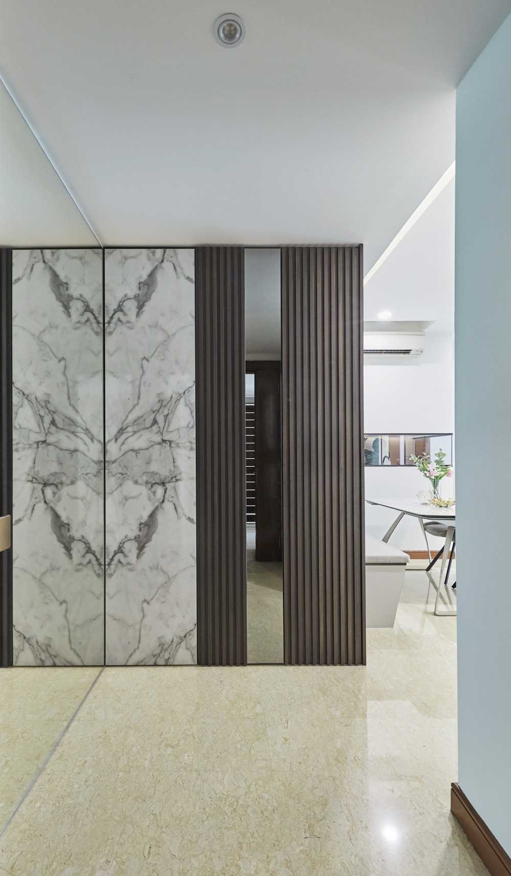 Scandinavian Entryway with Wardrobe and Paintings