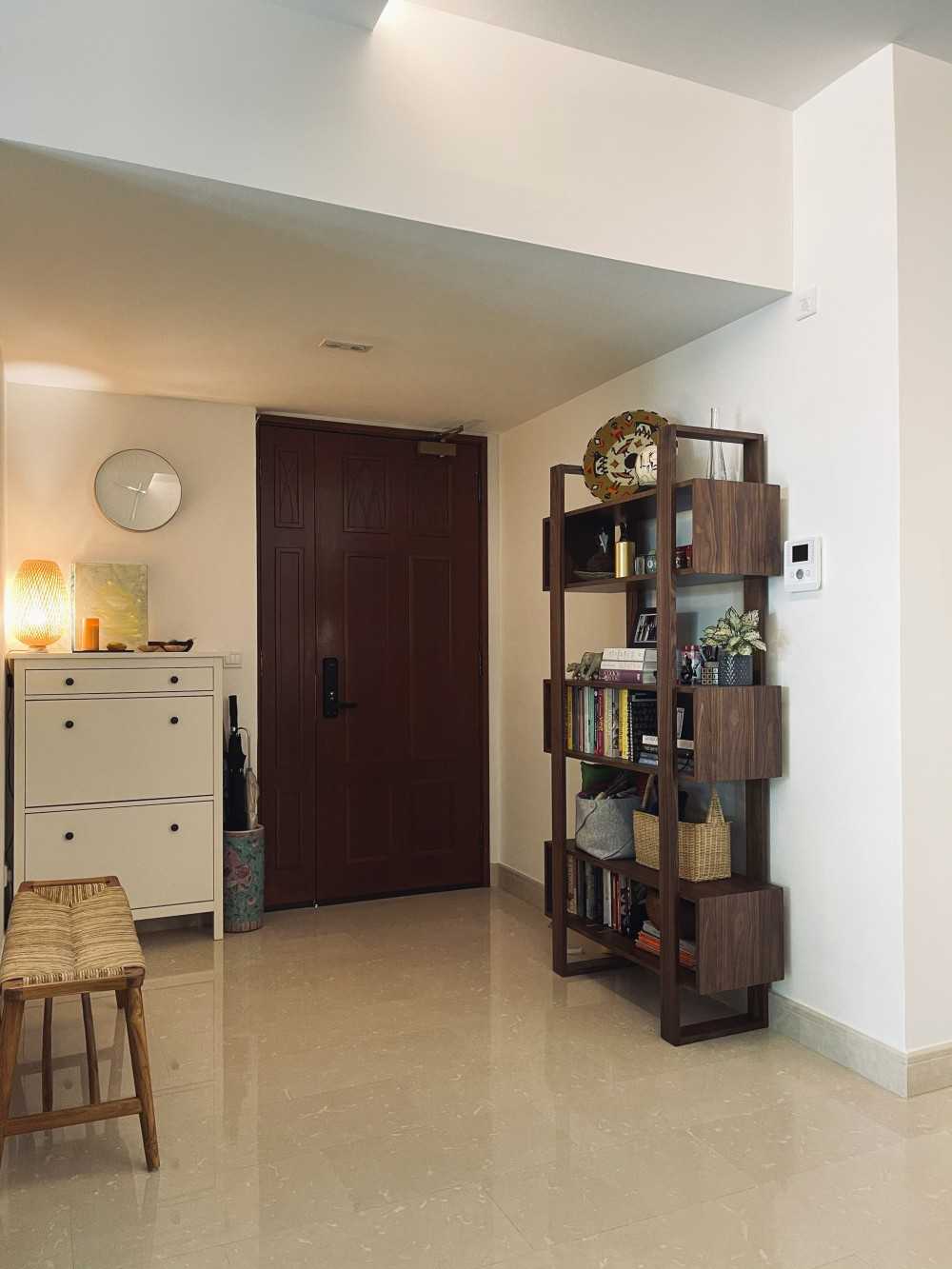 Scandinavian Foyer with Paintings and Storage Cabinets