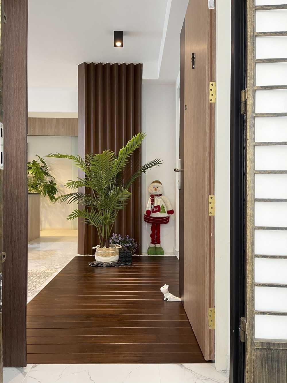 Scandinavian Entryway with Wood Flooring and Feature Wall