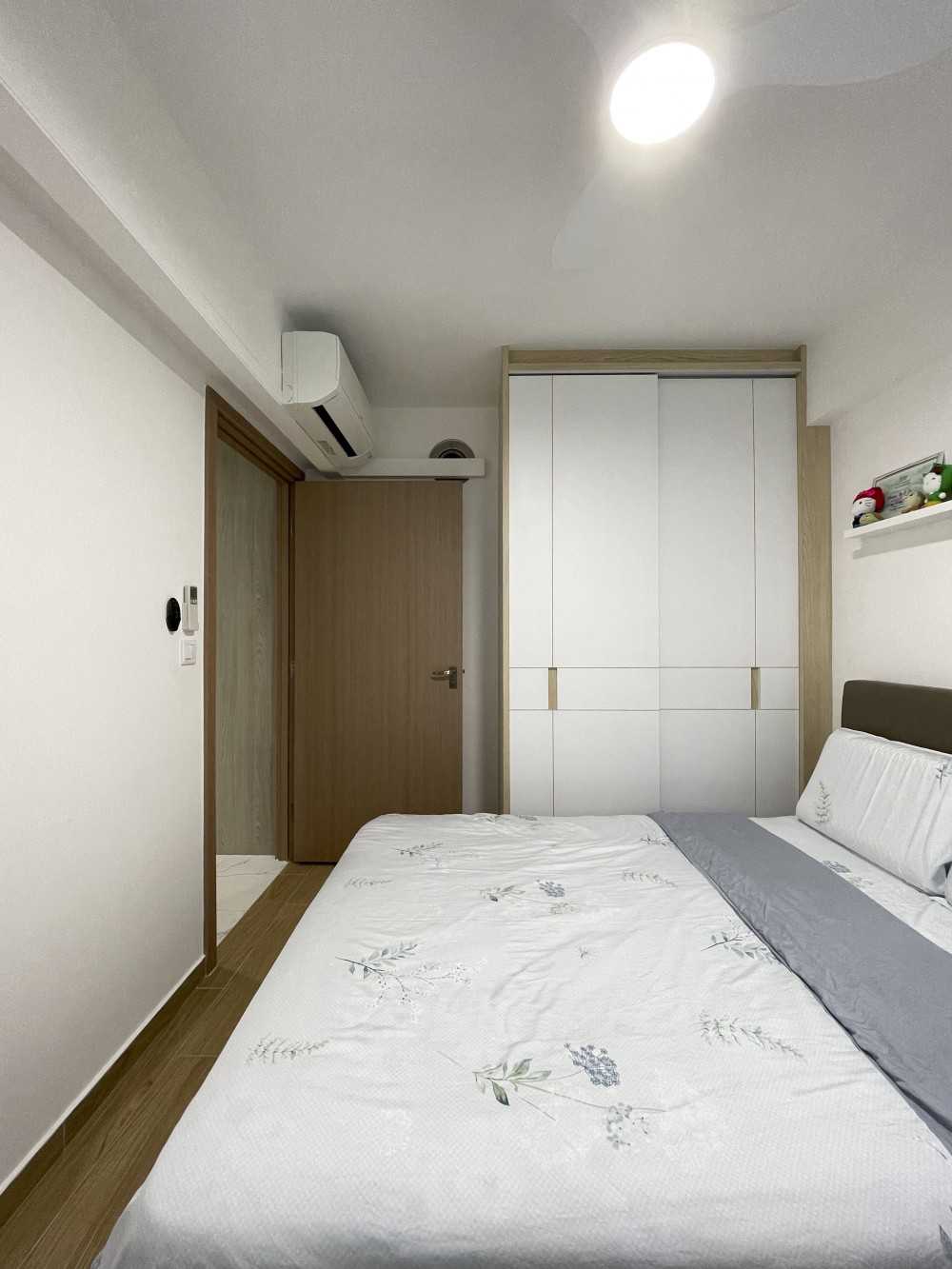 Scandinavian Bedroom with Wardrobe and Paintings