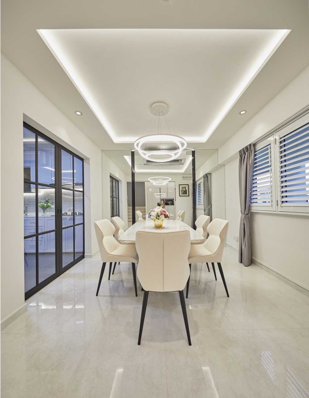 Modern Dining Room with Drop Light and Mirror