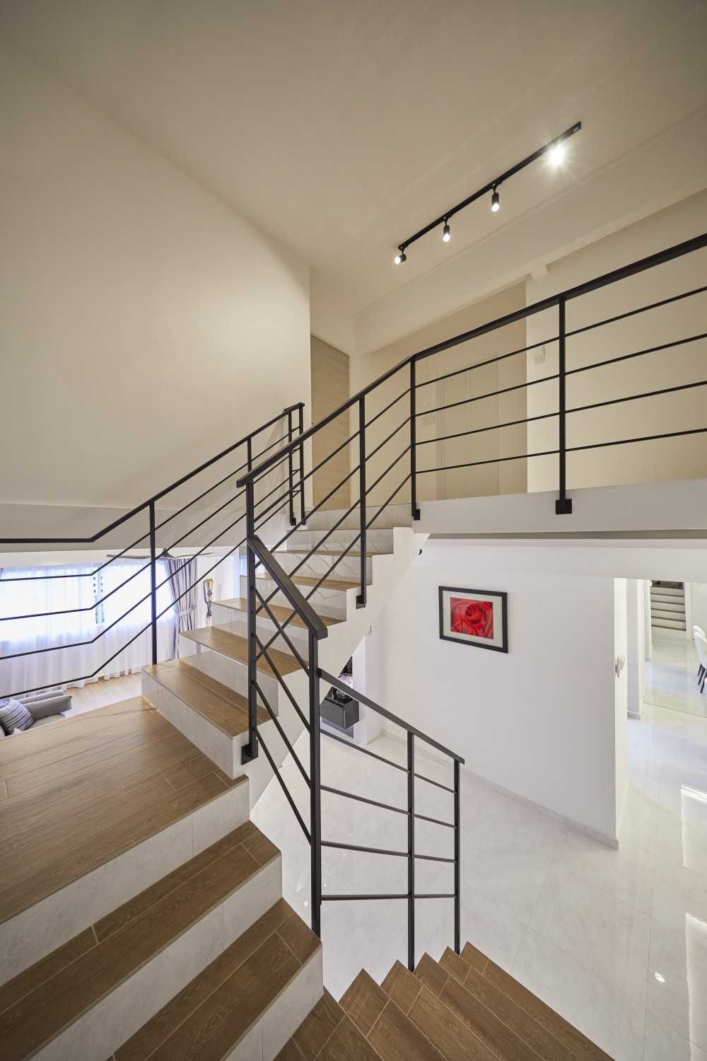 Modern Bedroom with Staircase and Paintings