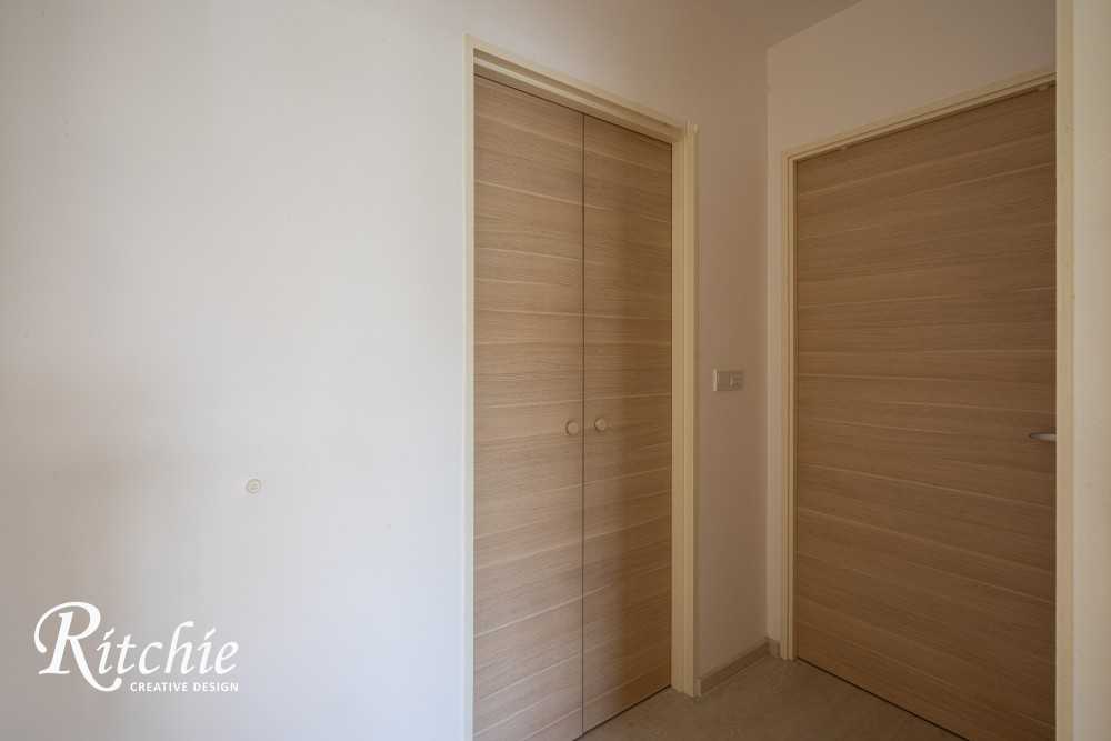 Minimalist Entryway with Doors and Wood Doors